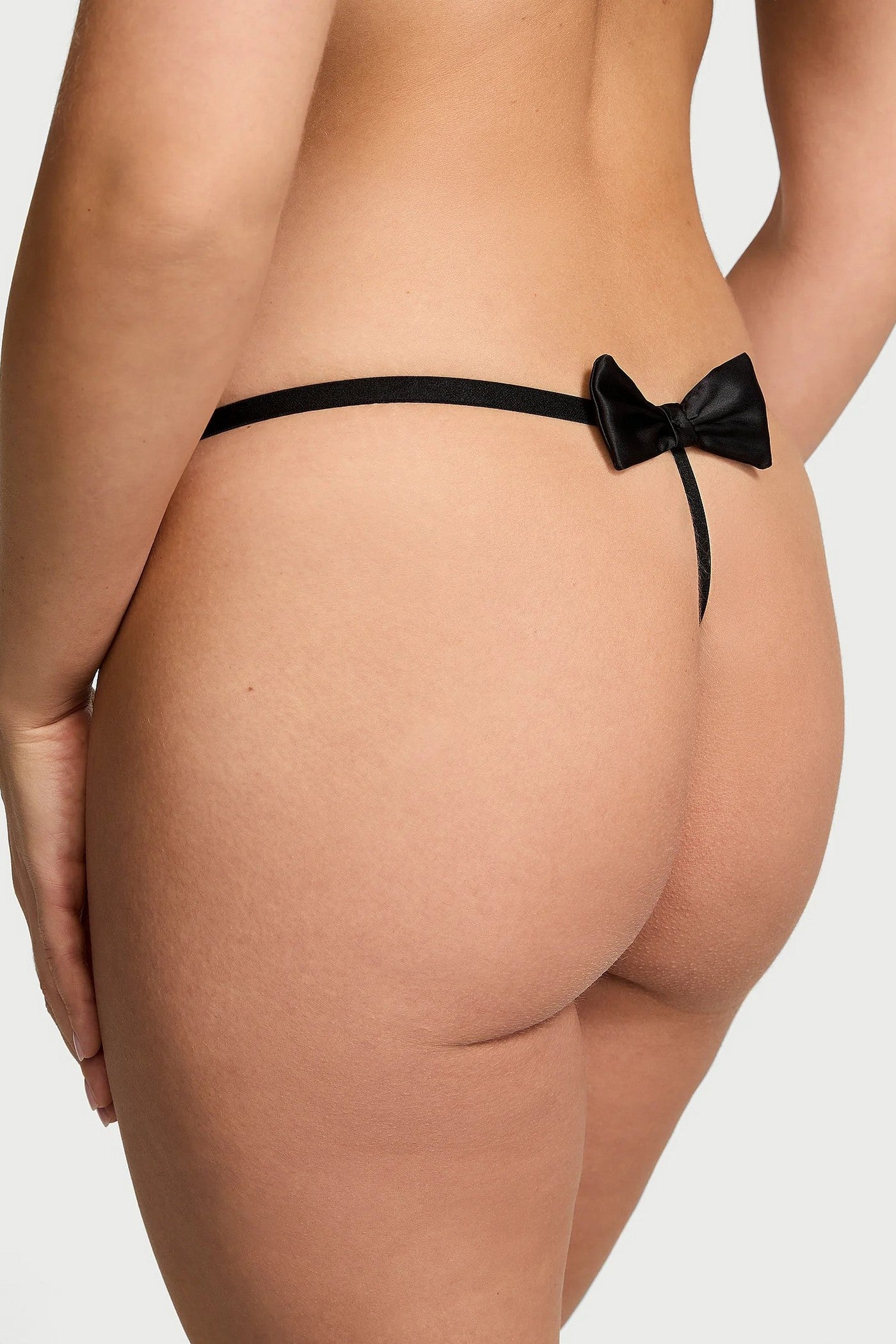 Трусики стринг с бантом 860281434 black